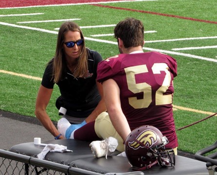 Instructor Jocelyn Dowling treats an athlete's sports injury.